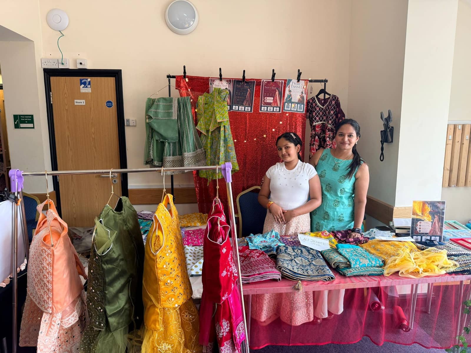 Folded lehengas and fabrics on the Twirl and Tassel stall table